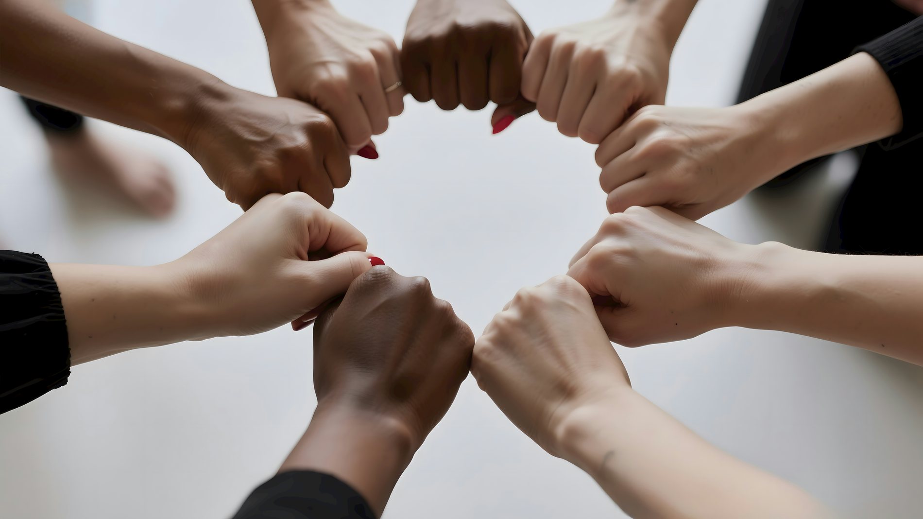 Women's hands meeting together in a circle